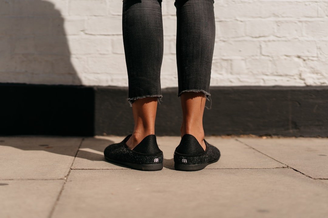 Black chunky platform loafers styled with tailored trousers